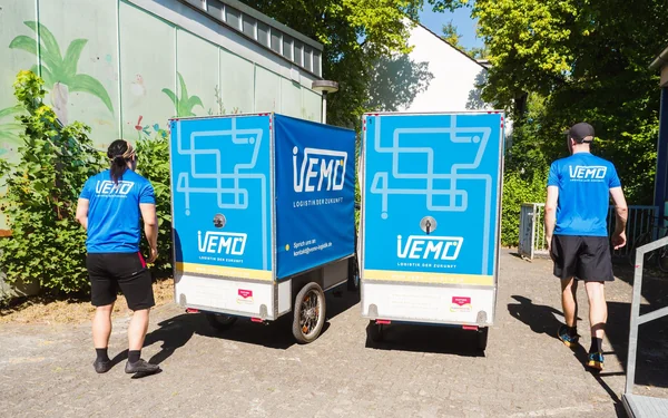 Two VEMO cargo bikes with riders